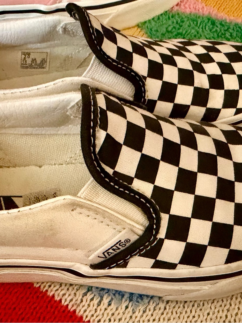 Vans Black and White Checkerboard Slip-On Sneakers